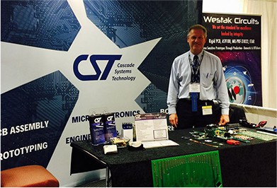 CST electronic contract manufacturing services rep at a trade show